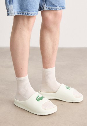 Lacoste
SERVE SLIDE 2.0 224 - Mules - off white/dark green