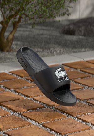 Lacoste
SERVE SLIDE 1.0 - Mules - black/white