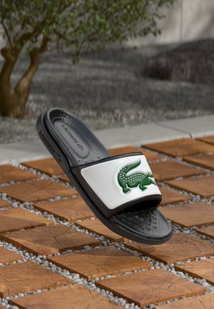Lacoste
SERVE SLIDE DS 225 - Mules - black/white